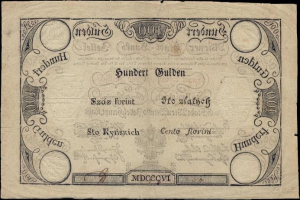 Alte deutsche 100-Pfennig-Banknote mit schwarzem Hintergrund und einem Männerporträt.